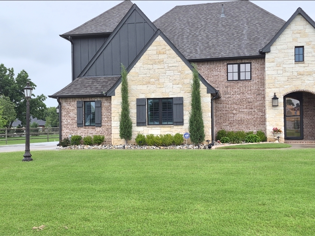 Brick and stone home exterior with tinted windows