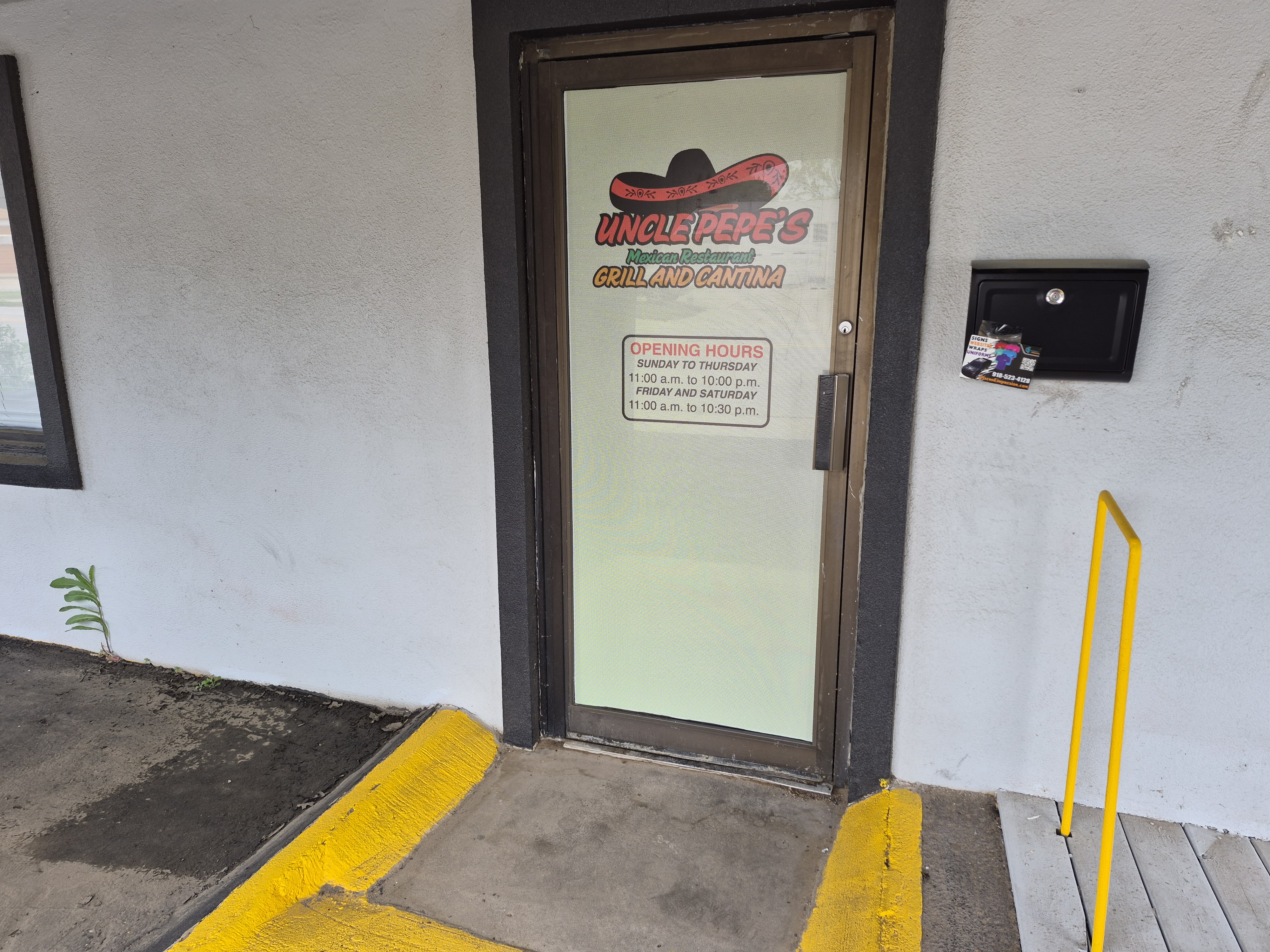 Tinted glass door at local restaurant